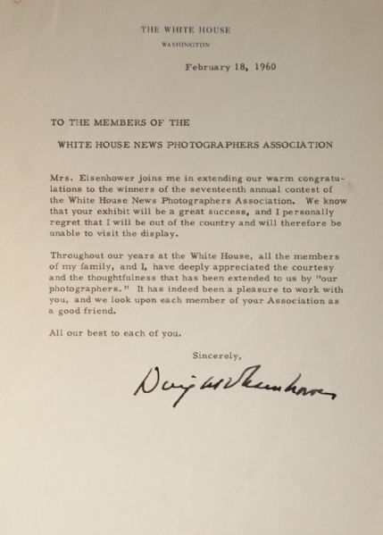 Dwight Eisenhower awards the White House News Photographers