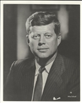Kennedy Administration- Cancelled dinner menu, Prayer card, Commemorative Book “John F. Kennedy 1917-1963,” Bachrach JFK portrait, vintage JFK limo photo dated June 1963.